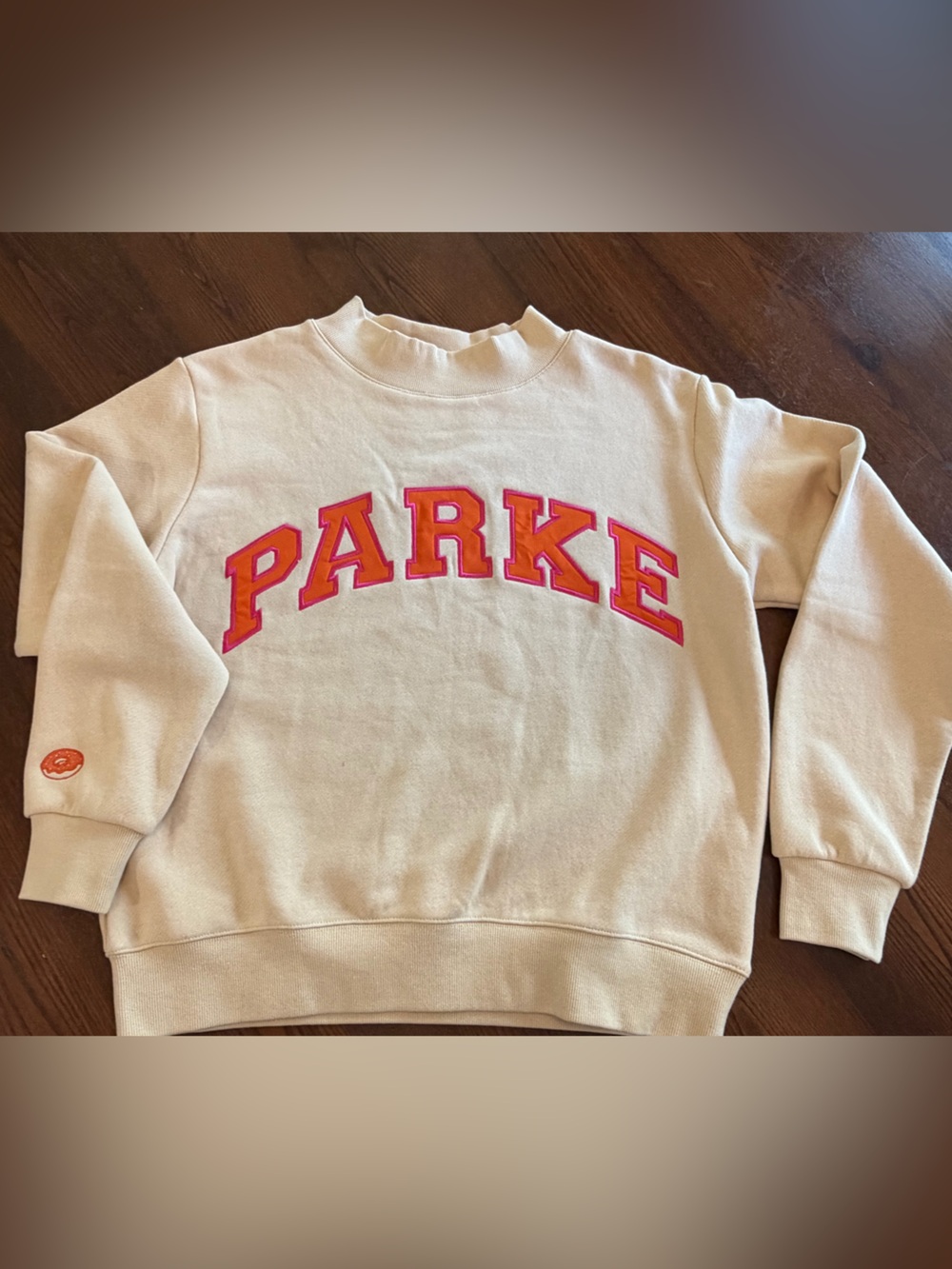 Parke Dunkin Collab Cream Crewneck Sweatshirt with Pink and Orange Logo